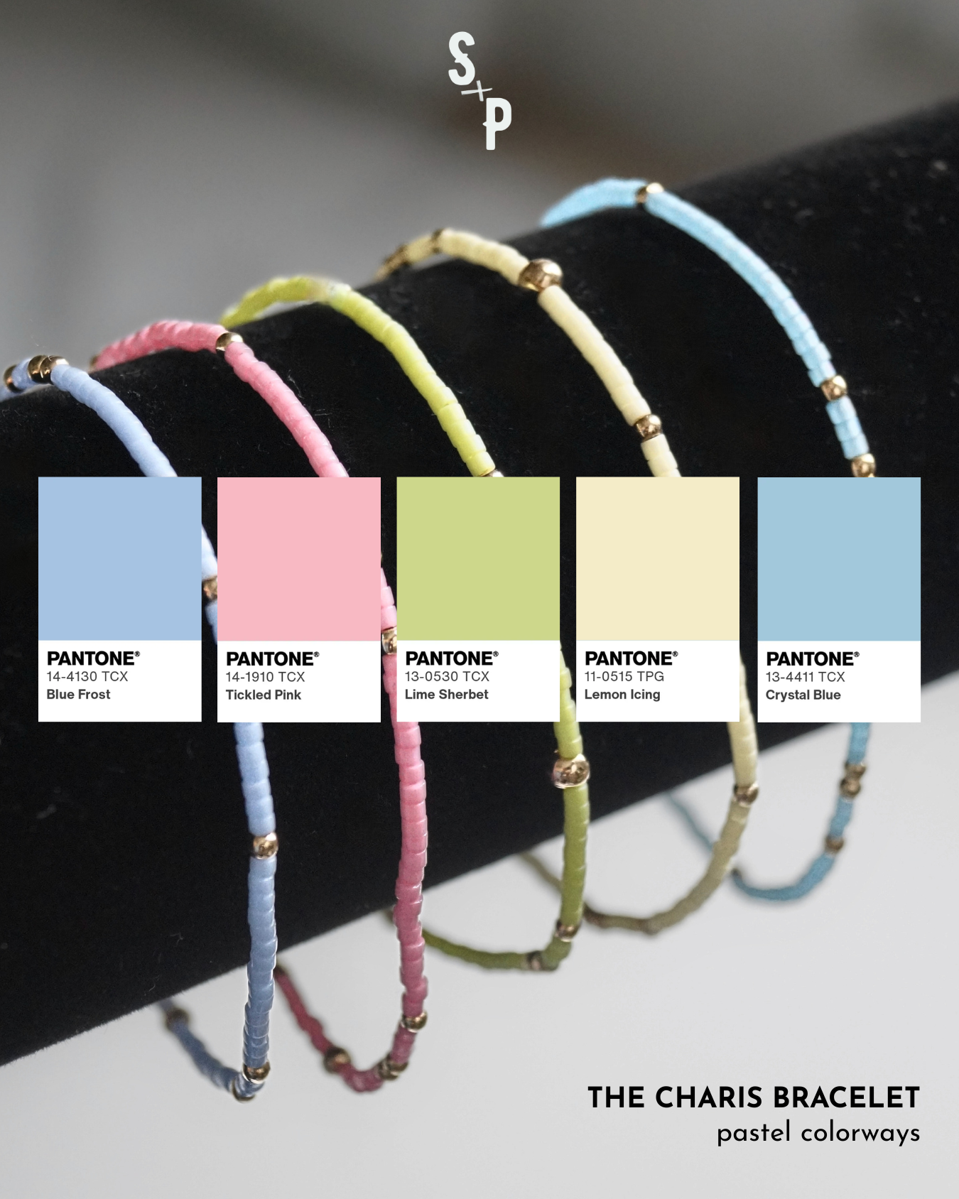 Set of colorful bracelets on a black stand with Pantone color swatches below with pastel colorways. 