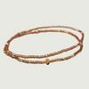 Gold 2mm beaded bracelet set with a gold cross and amber glass beads