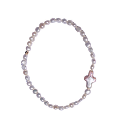 Pearl bracelet with a star-shaped clasp on a white background