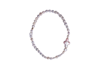 Pearl bracelet with a star-shaped clasp on a white background