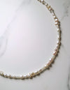 Pearl necklace on a marble surface