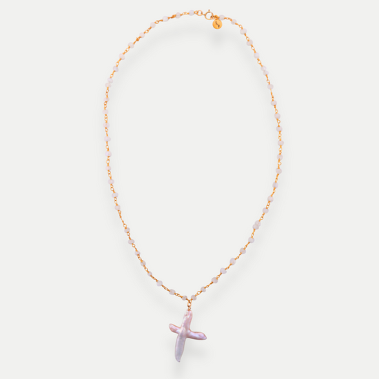 Necklace with a purple cross pendant on a white background