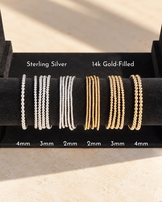 Beaded stacking bracelets in 14k gold filled or sterling silver, styled as a stack