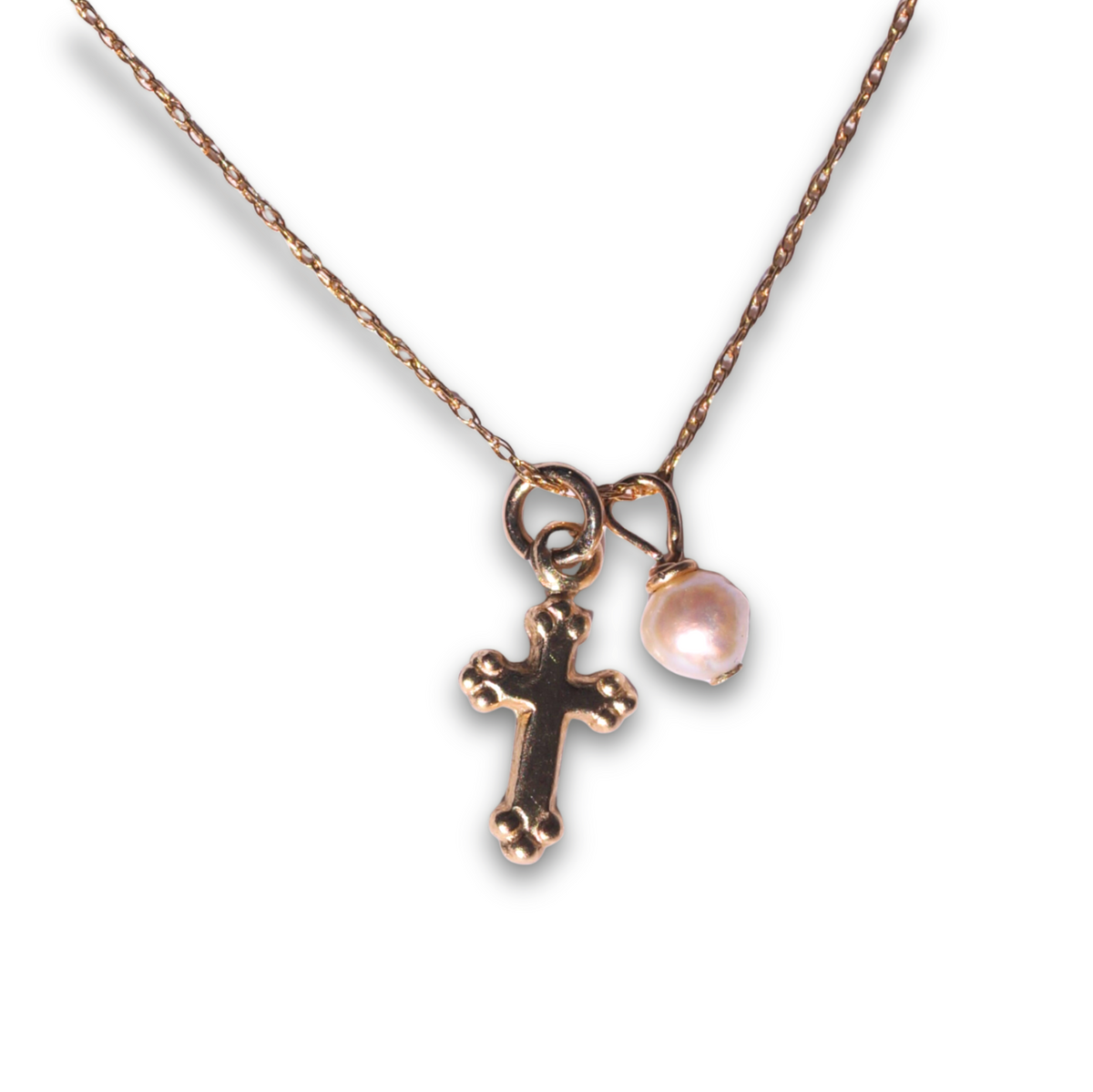 The Courtney Necklace with freshwater pearl and tiny gold cross charm, flat view