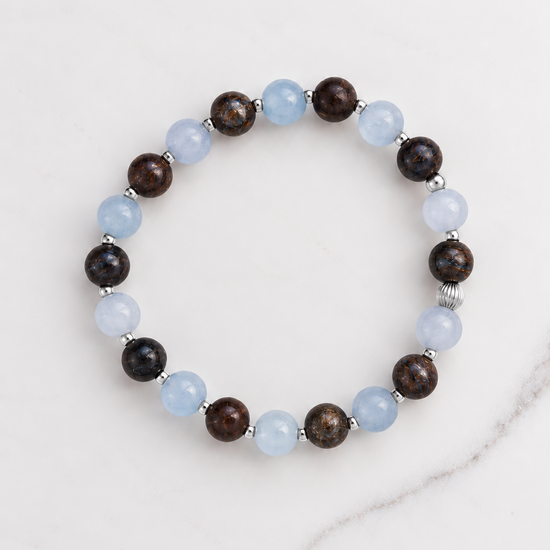 Aquamarine and Bronzite Beaded Bracelet in sterling silver, laid flat on white marble